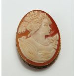 An orange shell cameo brooch/pendant depicting a l