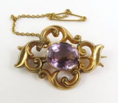 A Victorian amethyst set brooch, with scroll work