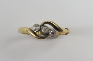 An early 20th century old cut diamond three stone