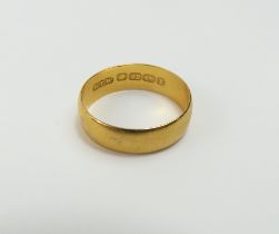 A 22ct gold wedding band, finger size K, 2.97g gro