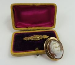 A Victorian 9ct gold panel brooch, cased, together