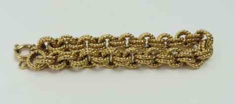 A fancy double twisted type link bracelet, 21cm lo