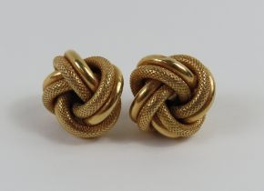 A pair of 9ct gold partially patterned knot stud e
