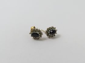 A pair of of 9ct sapphire and diamond stud earring