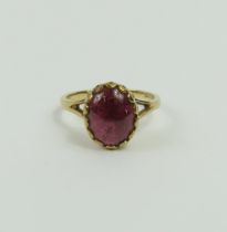 A 9ct gold cabochon cut garnet ring, finger size K