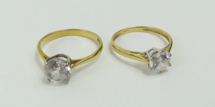 A single stone CZ ring with a four claw setting, f