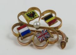 A WWI allied flag brooch in the shape of an openwo