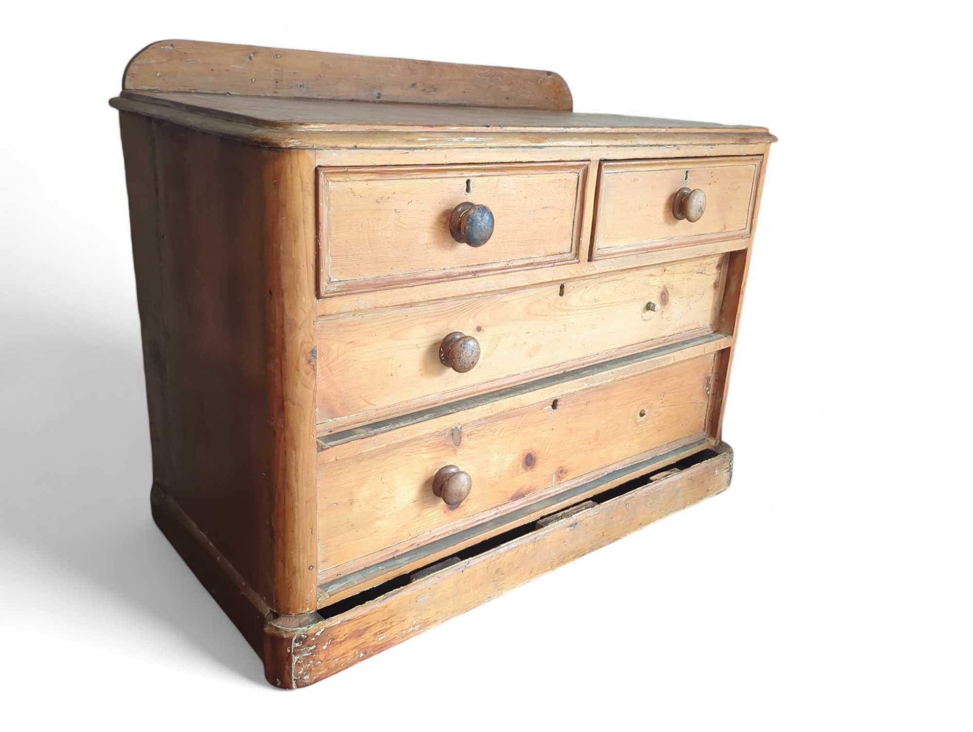 A short pine chest of drawers