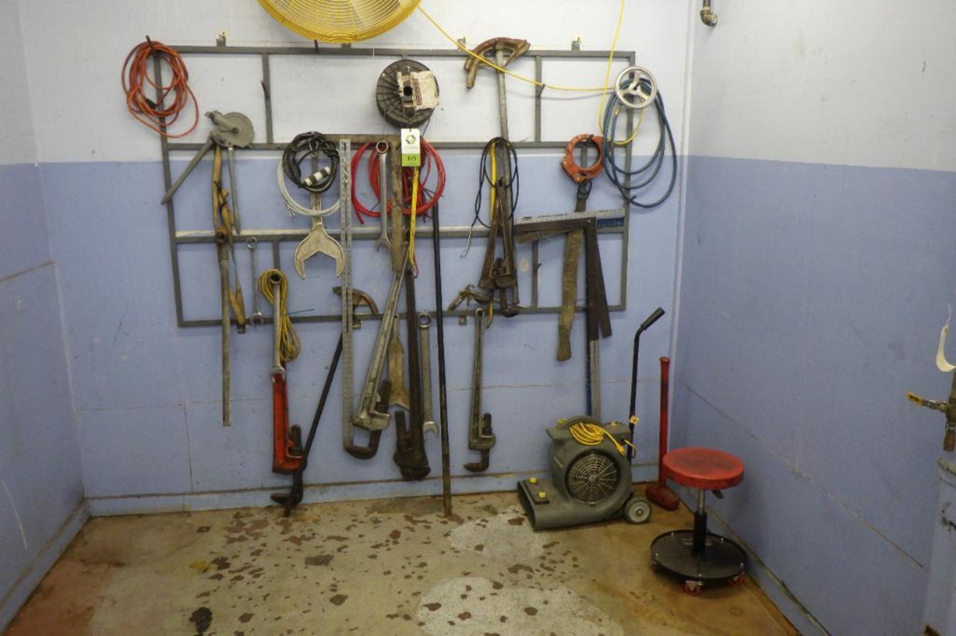 Assorted tools hanging on wall
