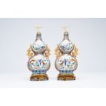 A pair of Chinese cloisonne double gourd vases on wooden stands, 20th C.