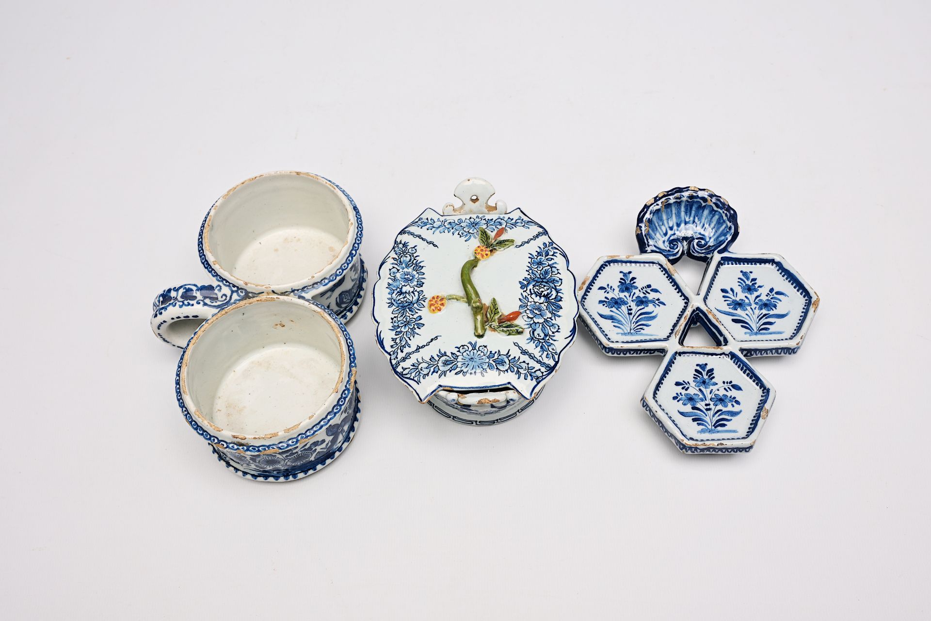 A Dutch Delft blue and white butter tub, an oil and vinegar holder and a spice dish with floral desi - Image 7 of 9