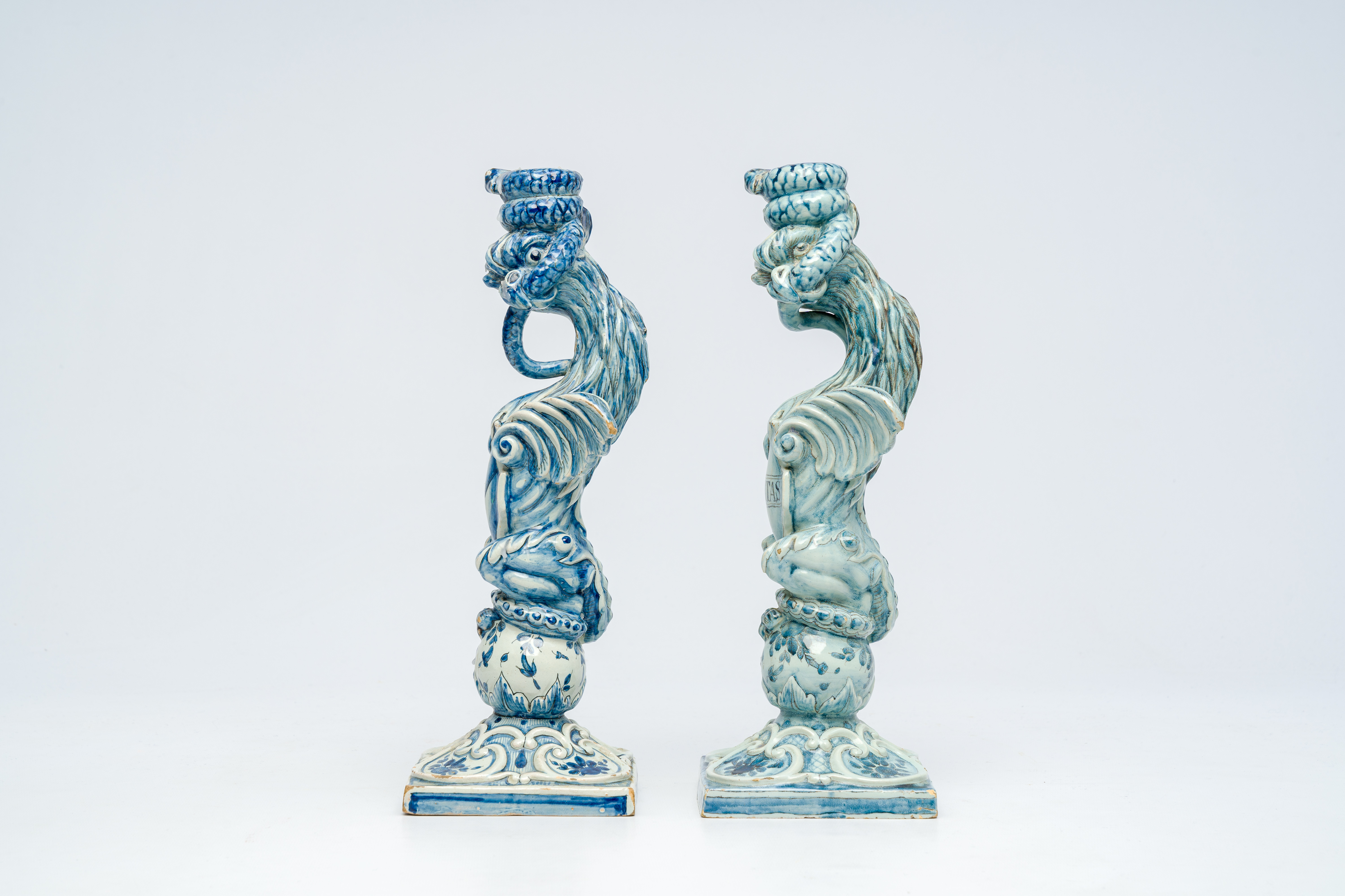 A pair of blue and white Italian pottery 'griffin' candlesticks, Cantagalli, late 19th C. - Image 3 of 7