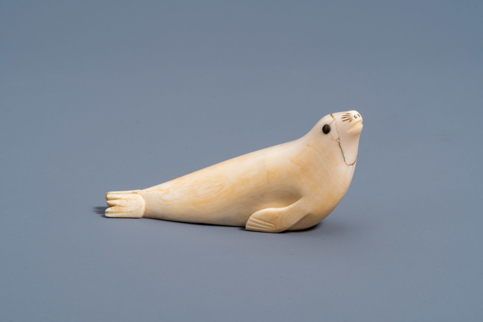 An Inuit carved whale ivory figure of a seal, Canada or Alaska, 19th C. - Image 2 of 11