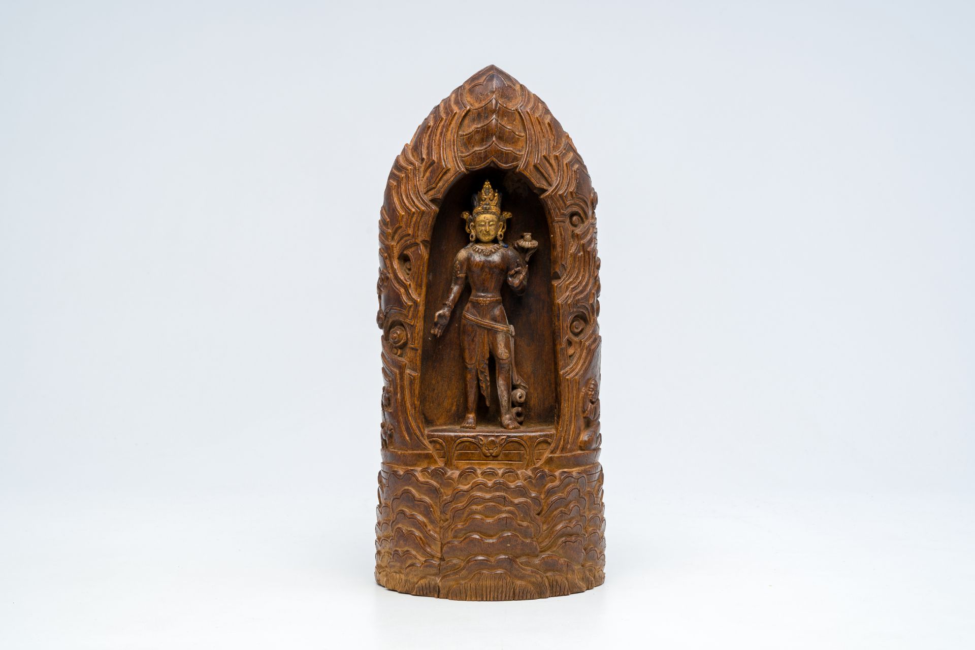 A Chinese or Tibetan partly gilded wooden votive Buddhist sculpture, 19th/20th C.