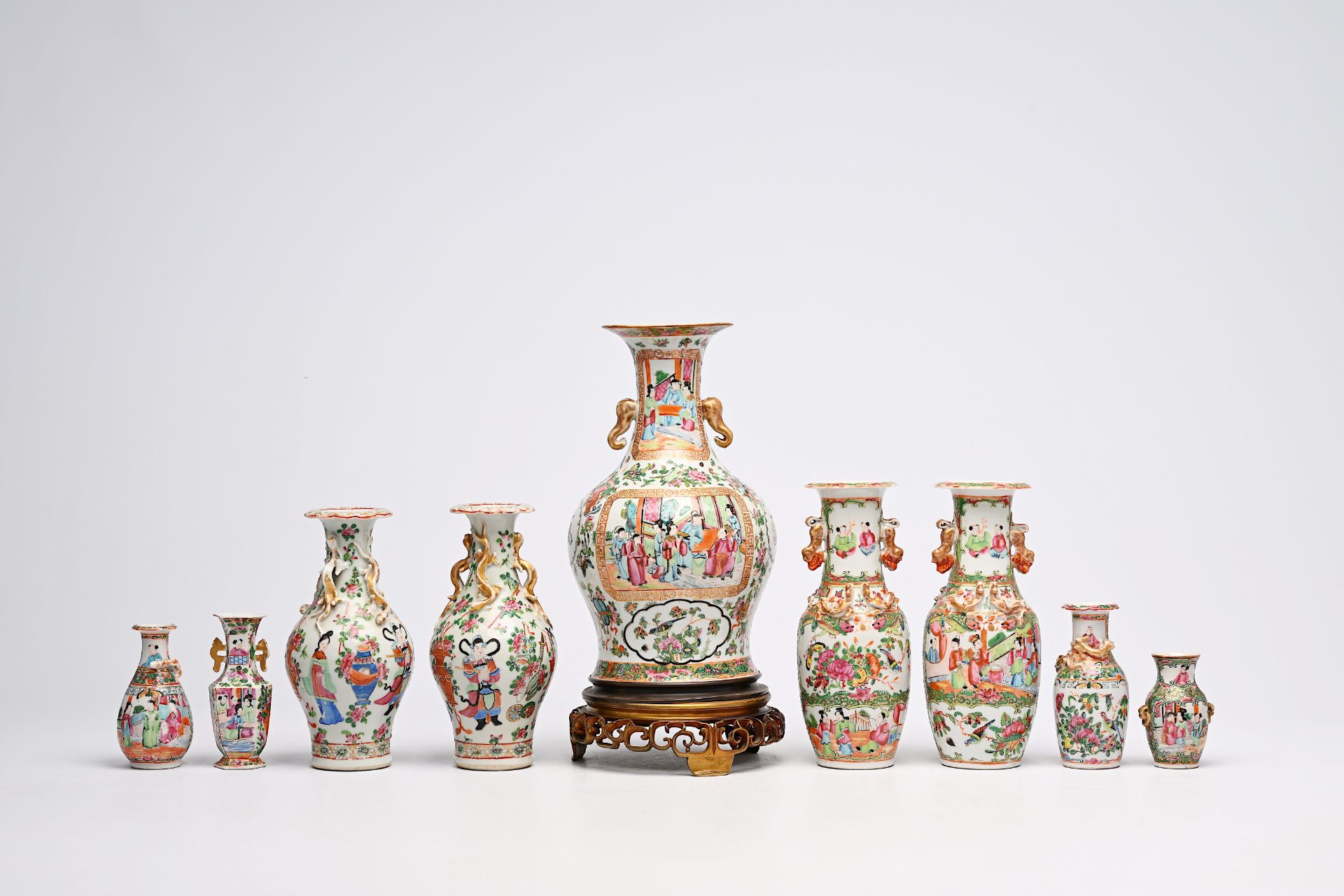 A varied collection of nine Chinese Canton famille rose vases, including two pairs, 19th C. - Image 5 of 8