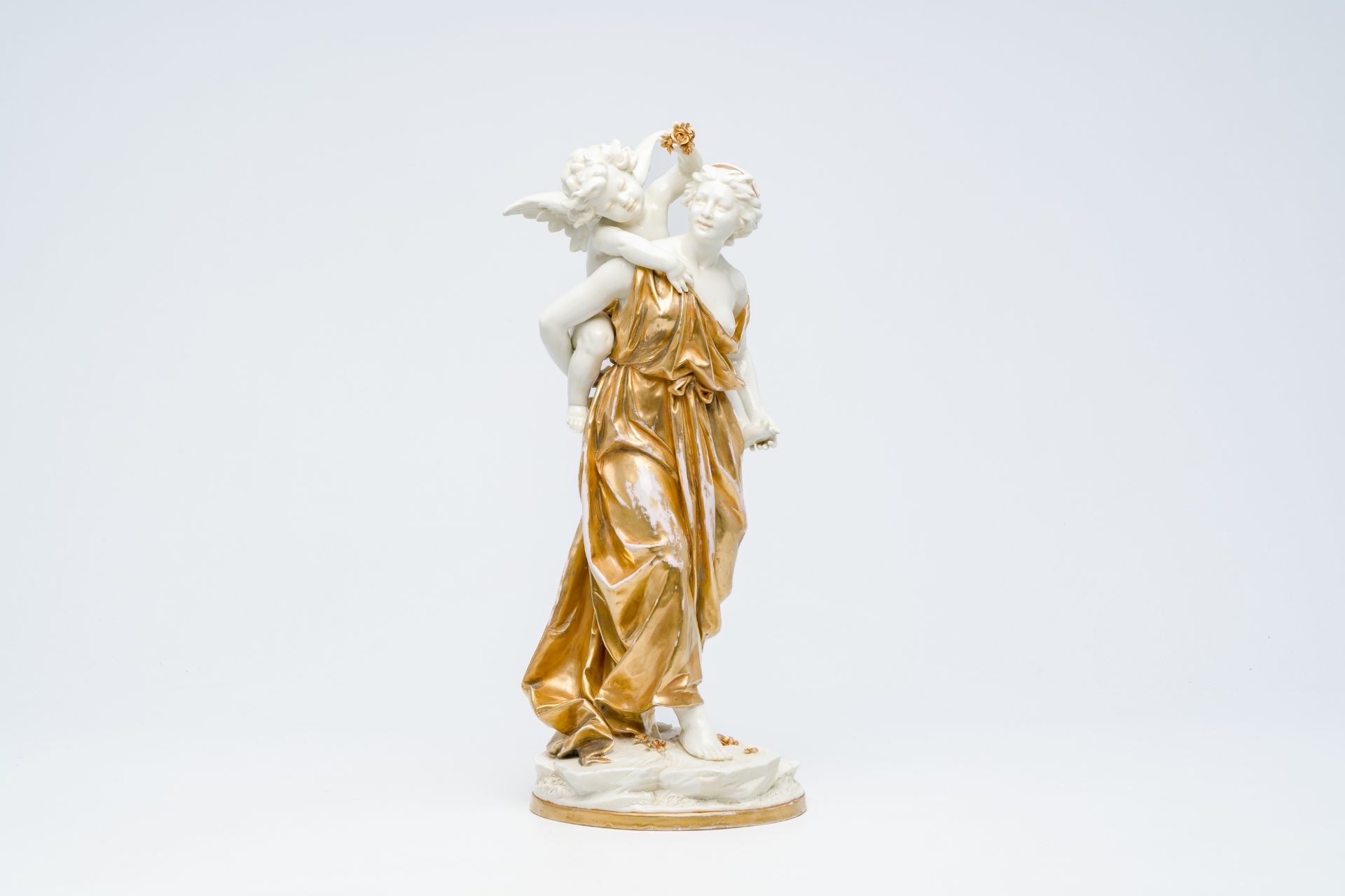 A lady with an angel in partly gilt Capodimonte porcelain, Italy, 20th C.