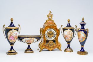 Three French gold layered SÃ¨vres style blue ground vases and covers, a coupe and a burl wood veneer