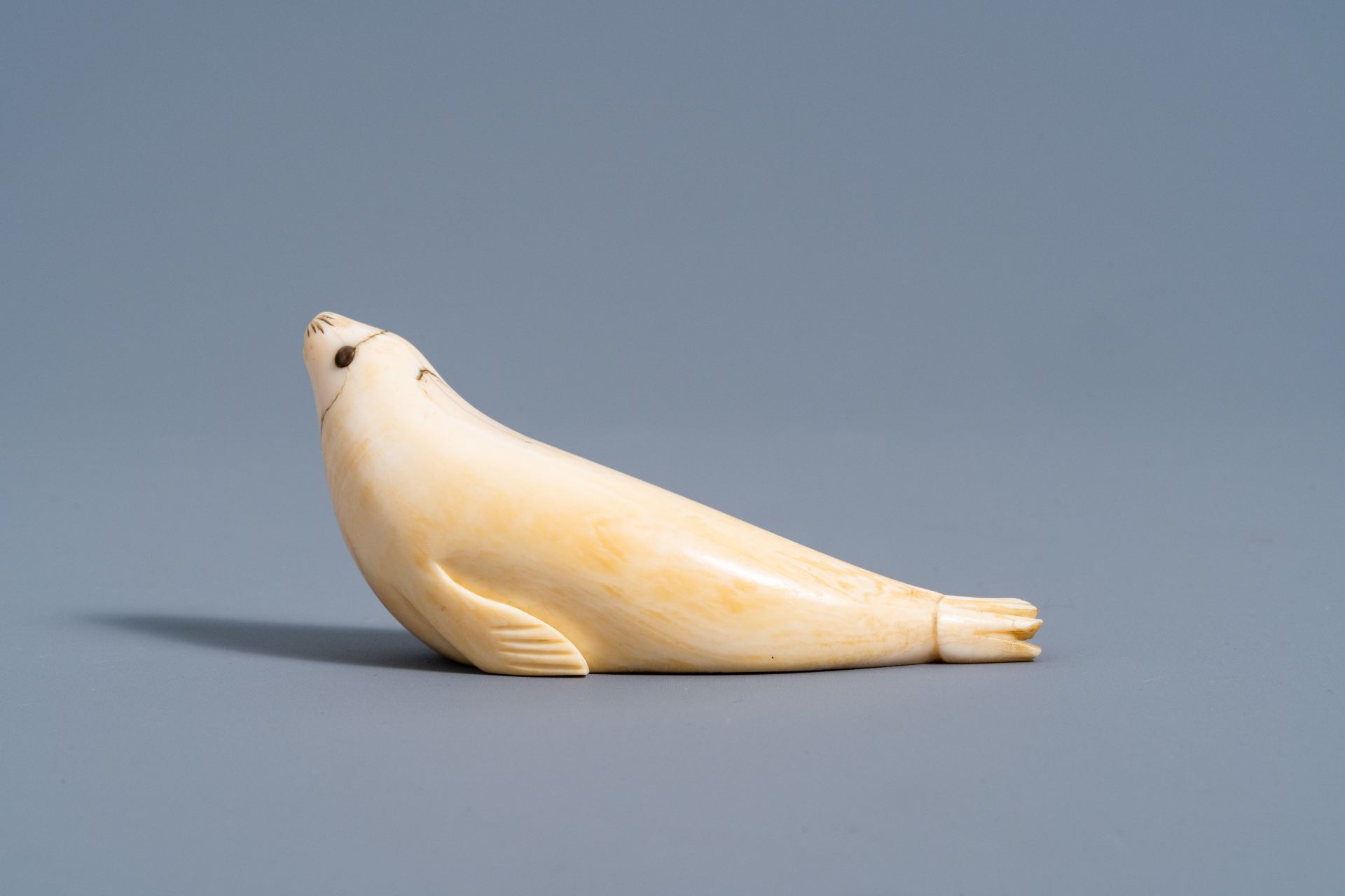 An Inuit carved whale ivory figure of a seal, Canada or Alaska, 19th C. - Image 5 of 11