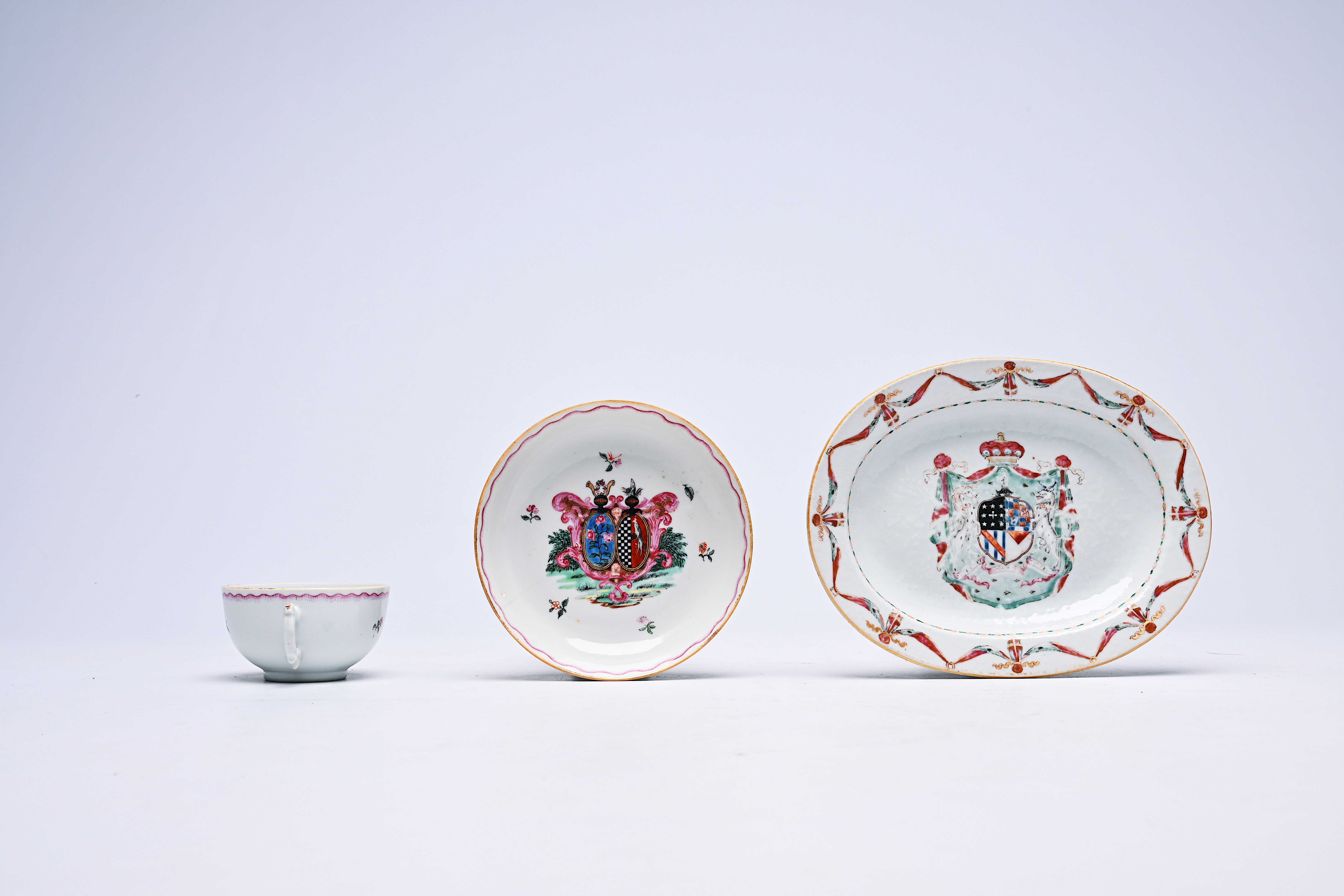 A Chinese famille rose armorial oval dish and a cup and saucer, Qianlong - Image 3 of 5