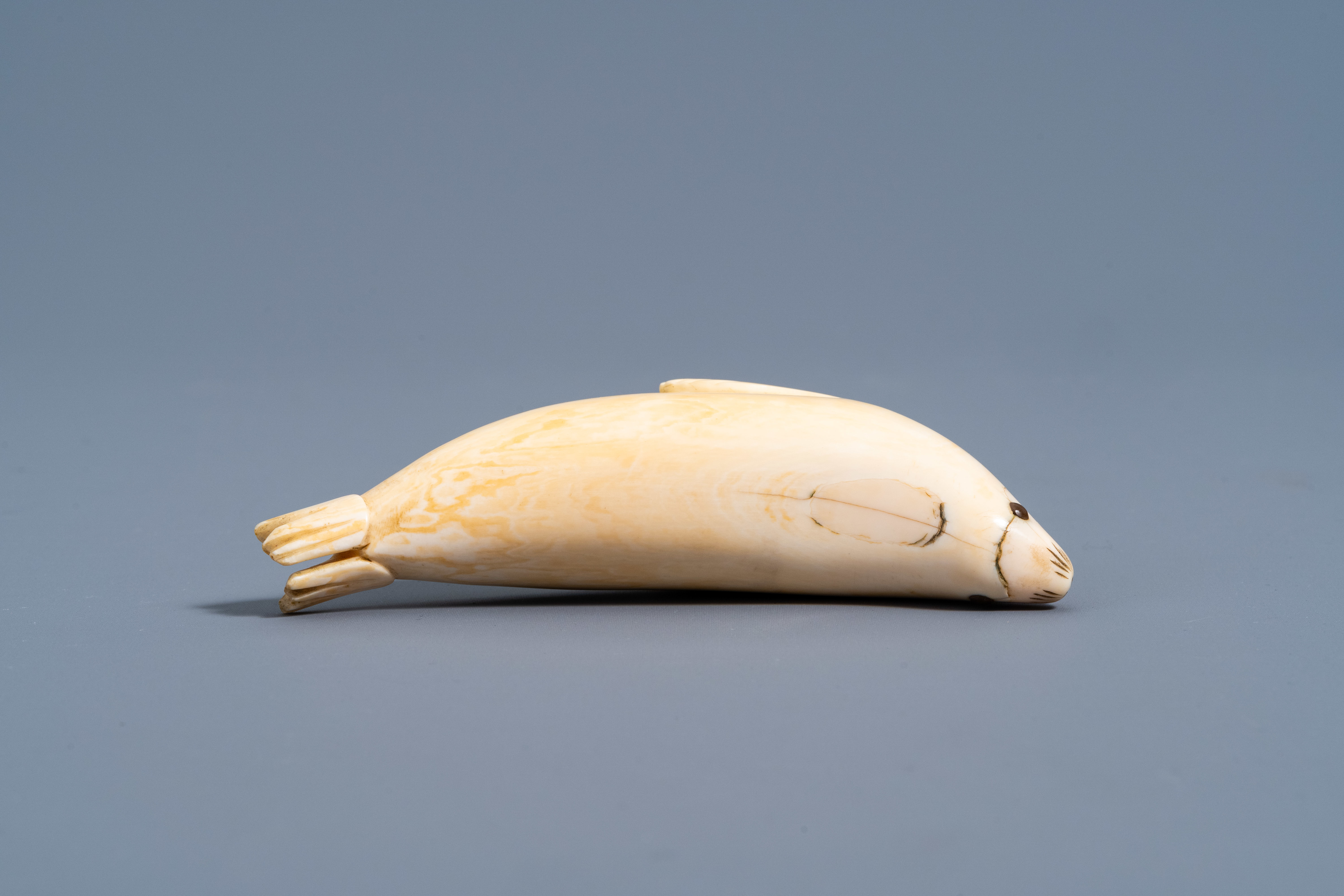 An Inuit carved whale ivory figure of a seal, Canada or Alaska, 19th C. - Image 7 of 11