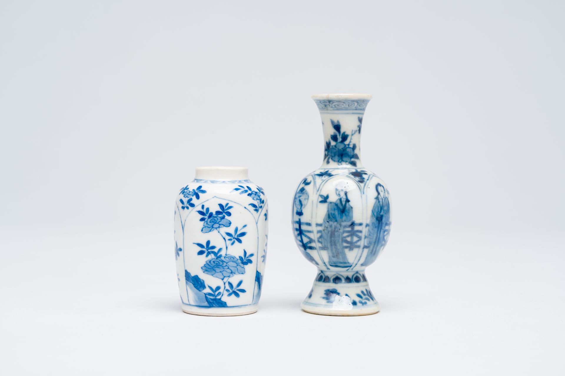 A Chinese blue and white soft paste vase with floral design and a 'ladies and birdcages' vase, Kangx