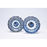 A pair of Chinese lobed blue, white and gilt plates with floral design, Qianlong