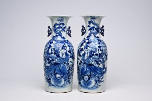 A pair of Chinese blue and white celadon ground vases with a dragon and a phoenix among blossoming b