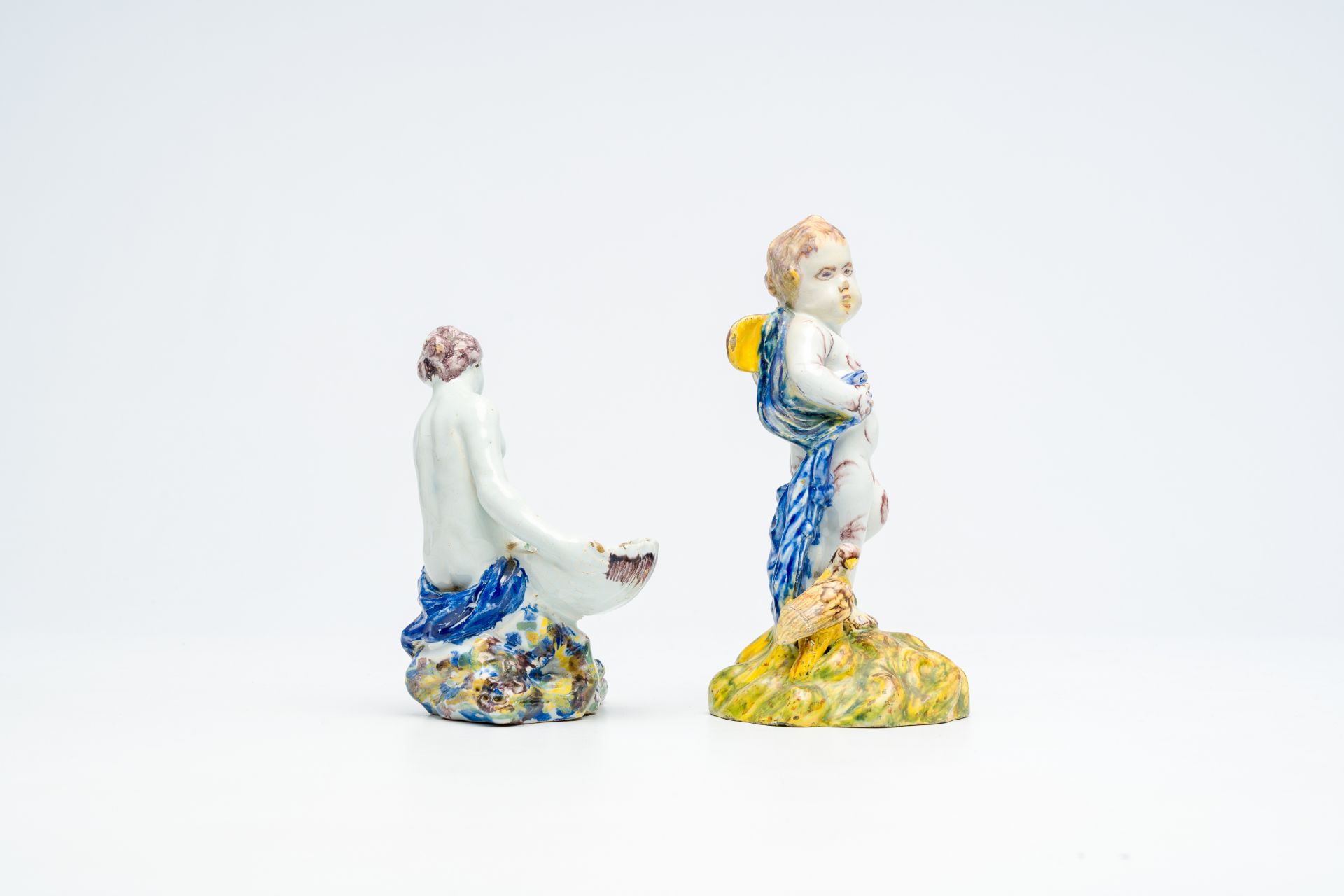 A polychrome 'putto and bird' faience sculpture and a 'lady with a shell' salt cellar, Delft or Brus - Image 4 of 7