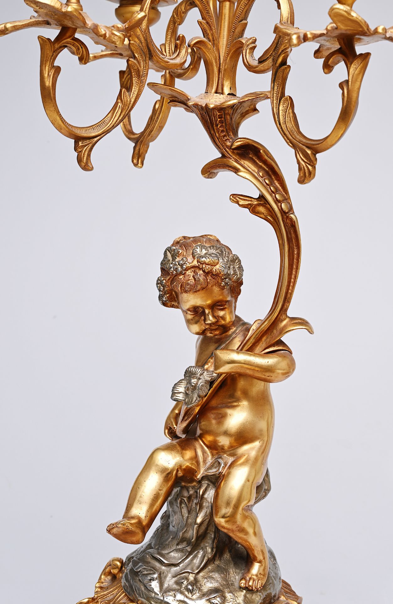 A French three-piece partly gilt metal clock garniture with putti, 20th C. - Image 8 of 11