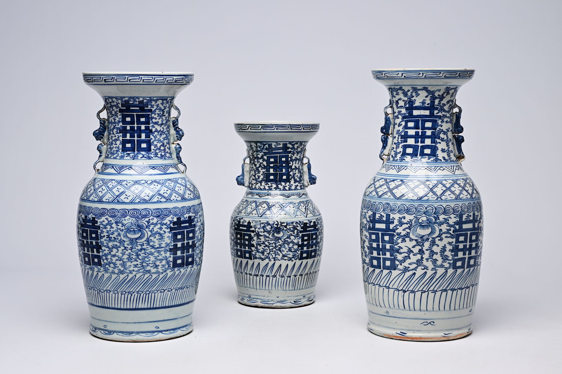 Three Chinese blue and white 'Xi' vases, 19th/20th C.