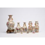 A varied collection of nine Chinese Canton famille rose vases, including two pairs, 19th C.