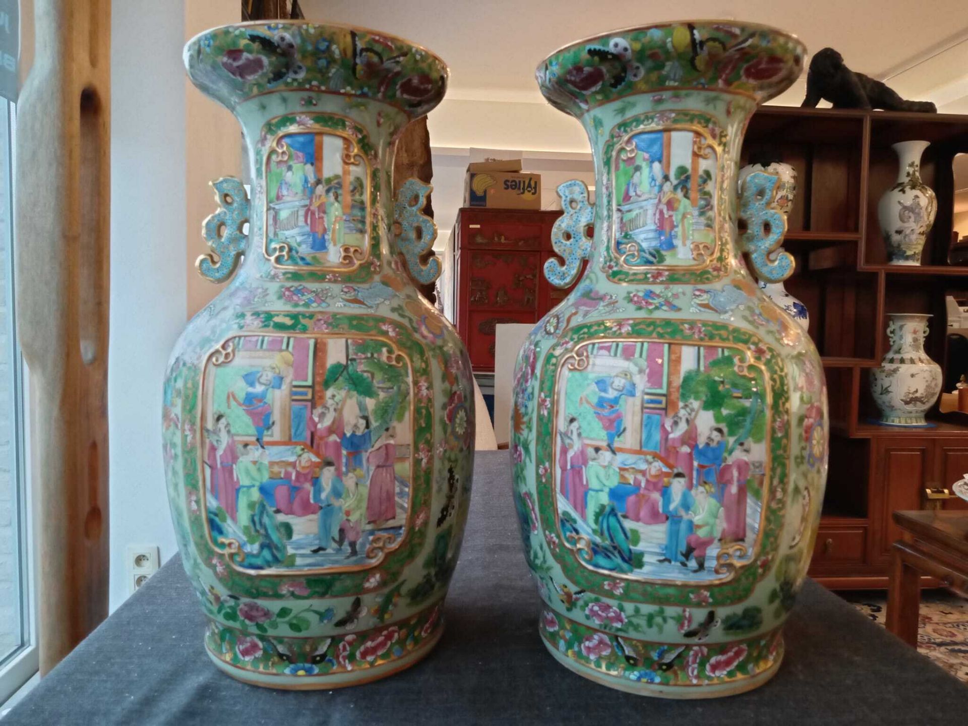 A pair of Chinese Canton famille rose celadon ground vases with palace scenes, animals and antiquiti - Image 15 of 64