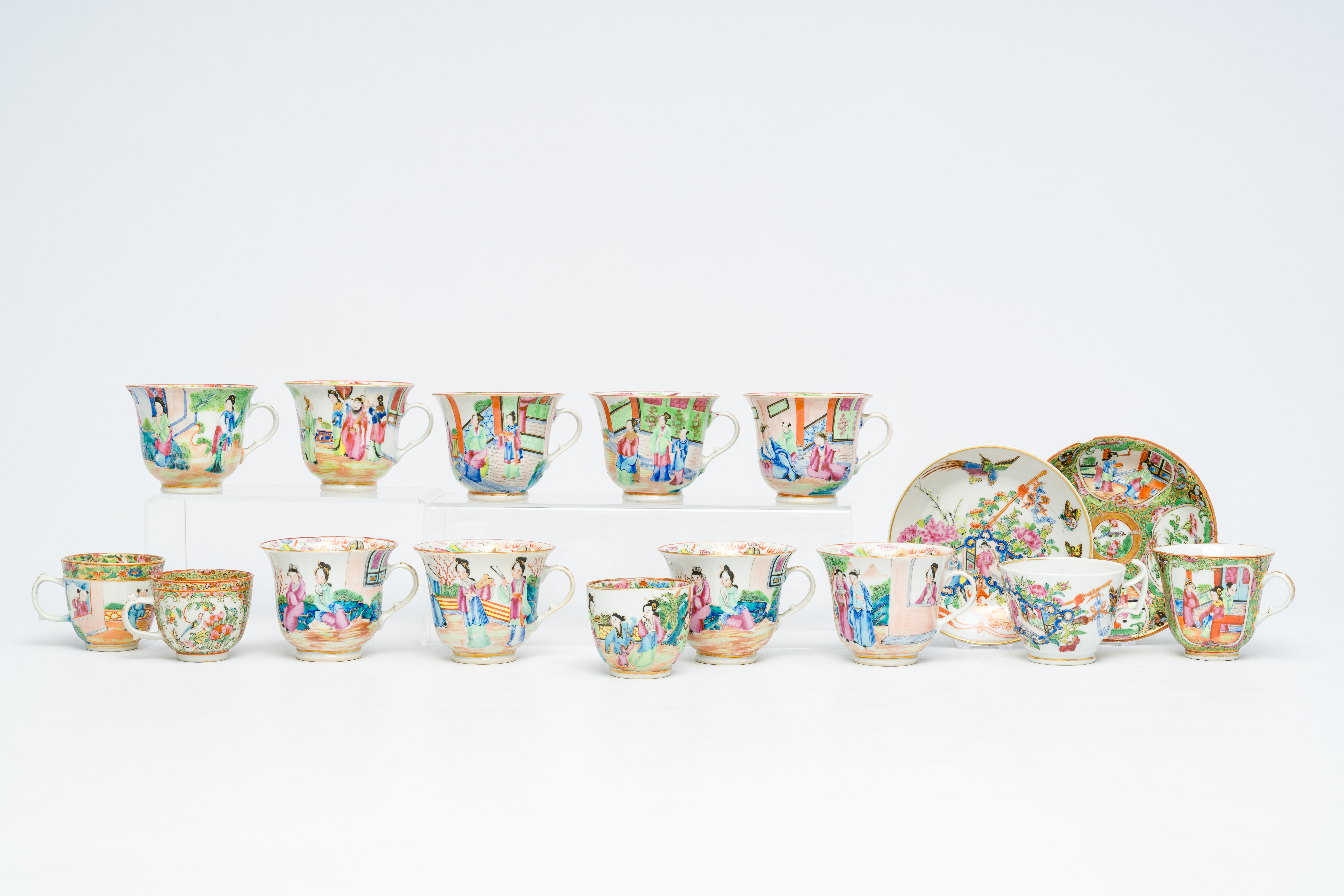14 Chinese Canton famille rose cups and two saucers, 19th C.