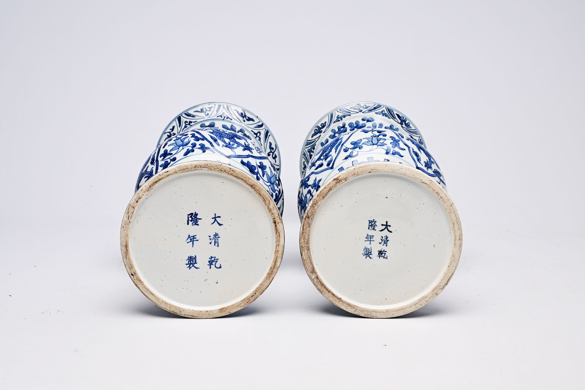 A pair of Chinese blue and white 'gu' vases with dragons and floral design, Qianlong mark, Republic, - Image 21 of 22