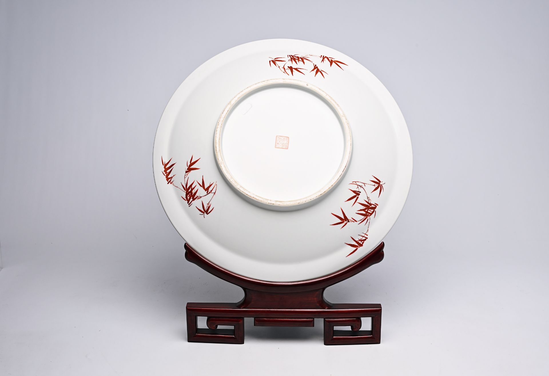 A large Chinese famille rose dish with ladies and children in a landscape, Qianlong mark, 20th C. - Image 4 of 16