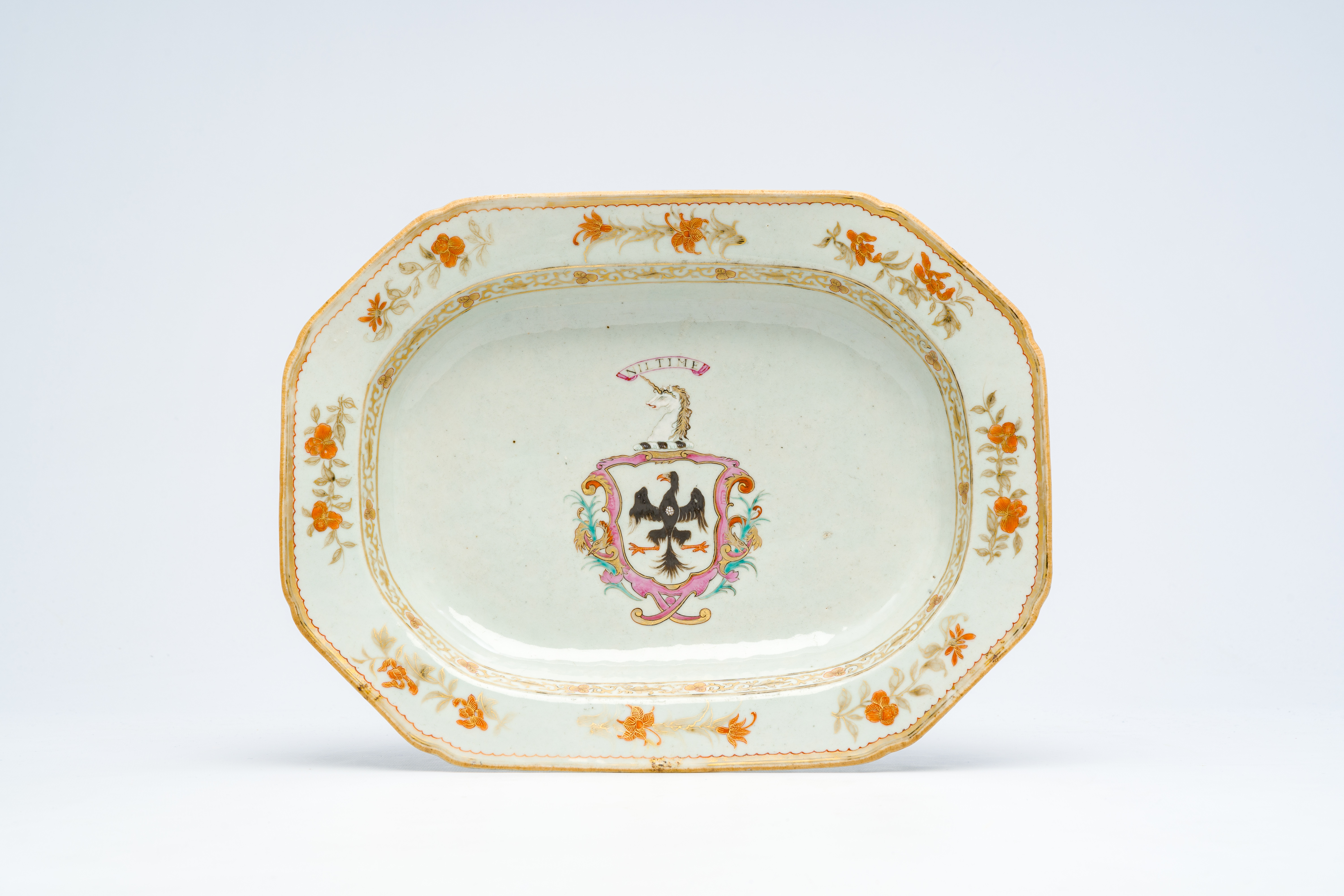 A Chinese famille rose English market armorial dish with the arms of Ramsay with a black eagle, a un