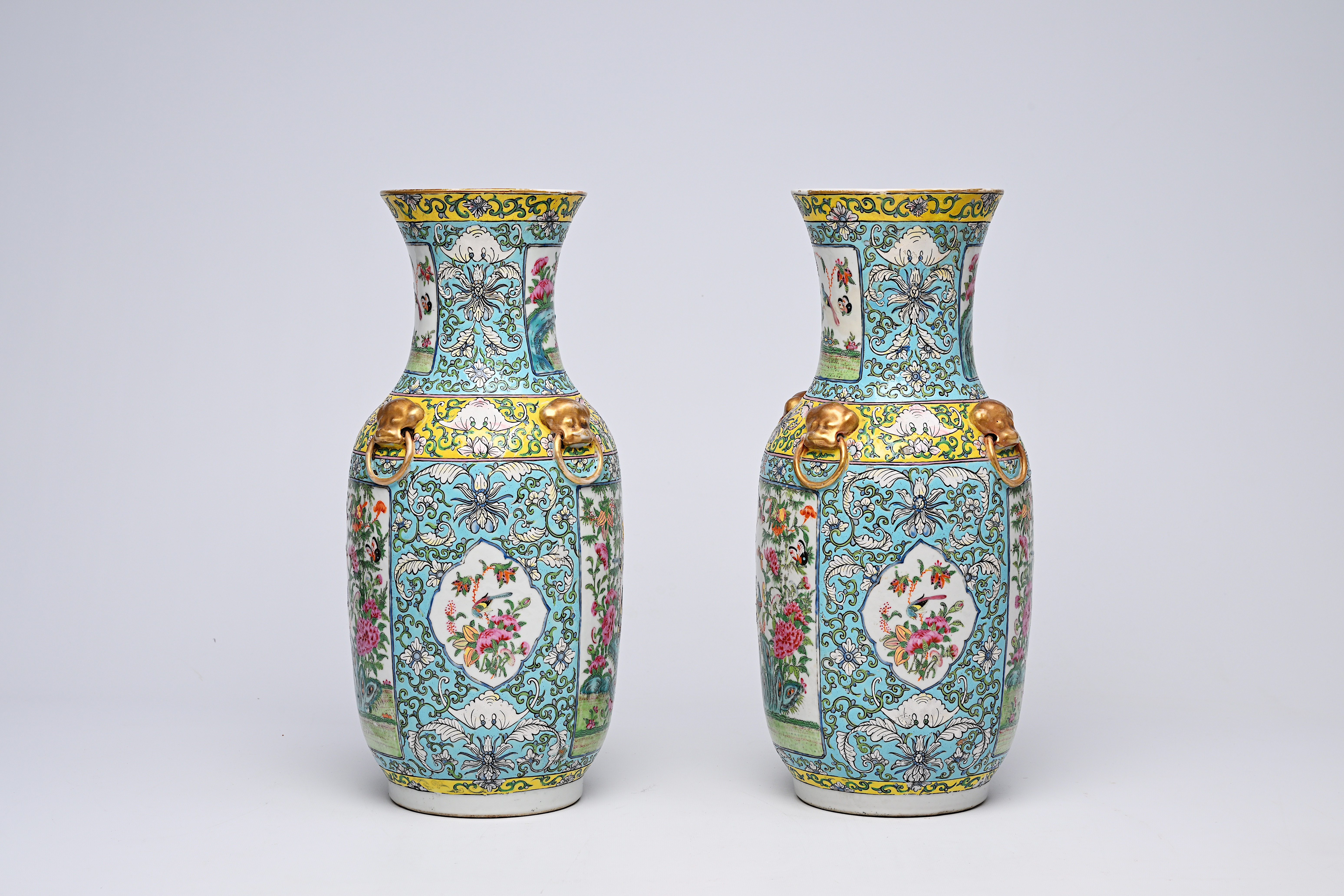 A pair of Chinese Canton famille rose turquoise ground vases with birds and butterflies among blosso - Image 4 of 13