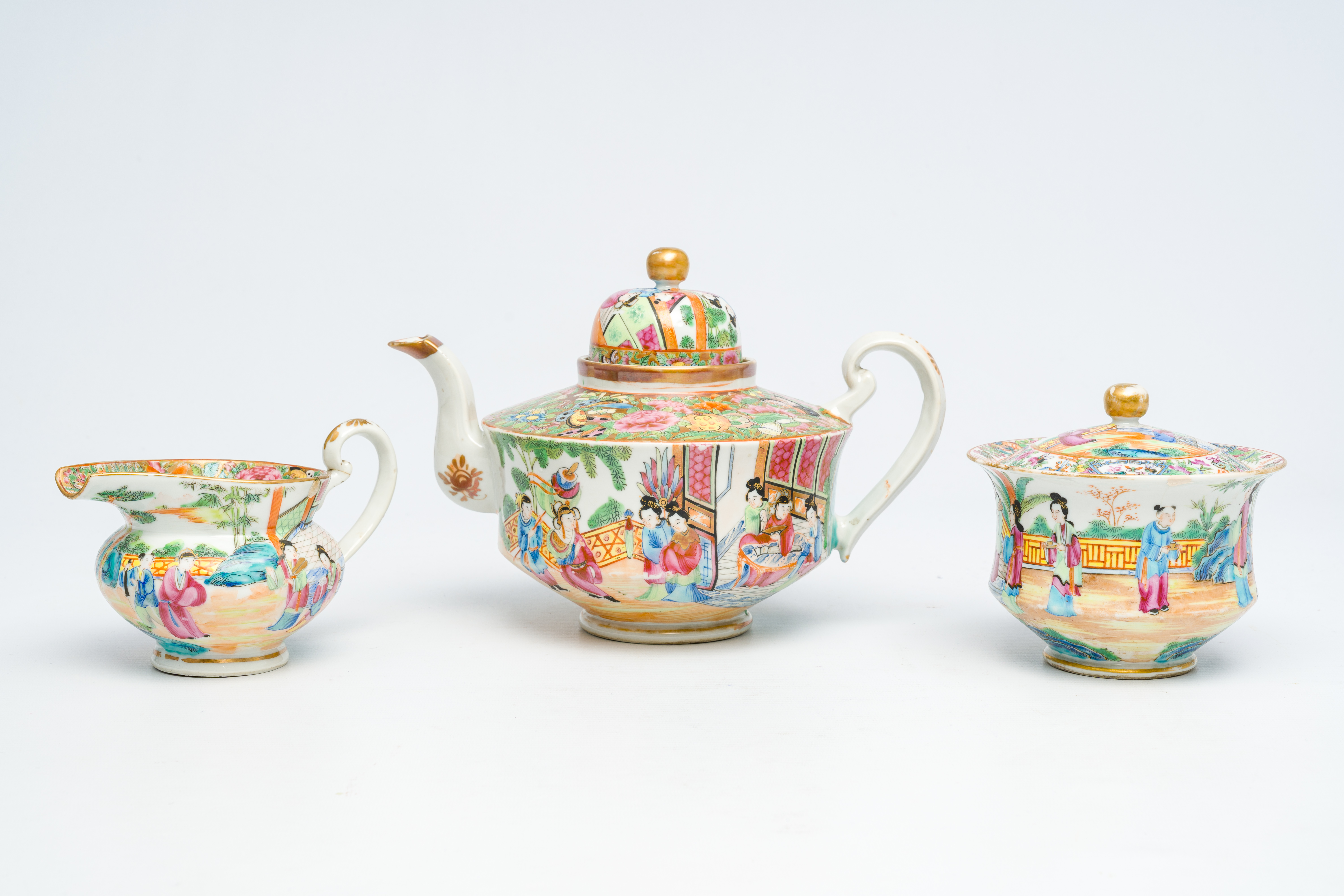 A Chinese Canton famille rose three-part tea set with palace scenes, 19th C.