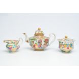 A Chinese Canton famille rose three-part tea set with palace scenes, 19th C.