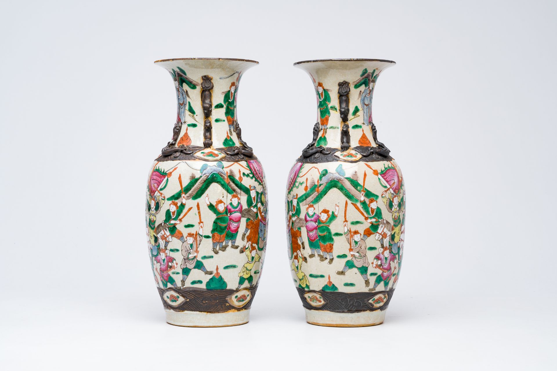 A pair of Chinese Nanking crackle glazed famille rose 'warrior' vases, 19th C. - Image 2 of 6