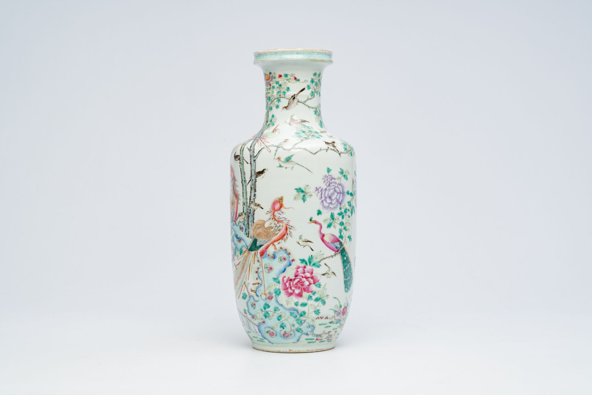 A Chinese famille rose rouleau vase with birds among blossoming branches, 19th C.