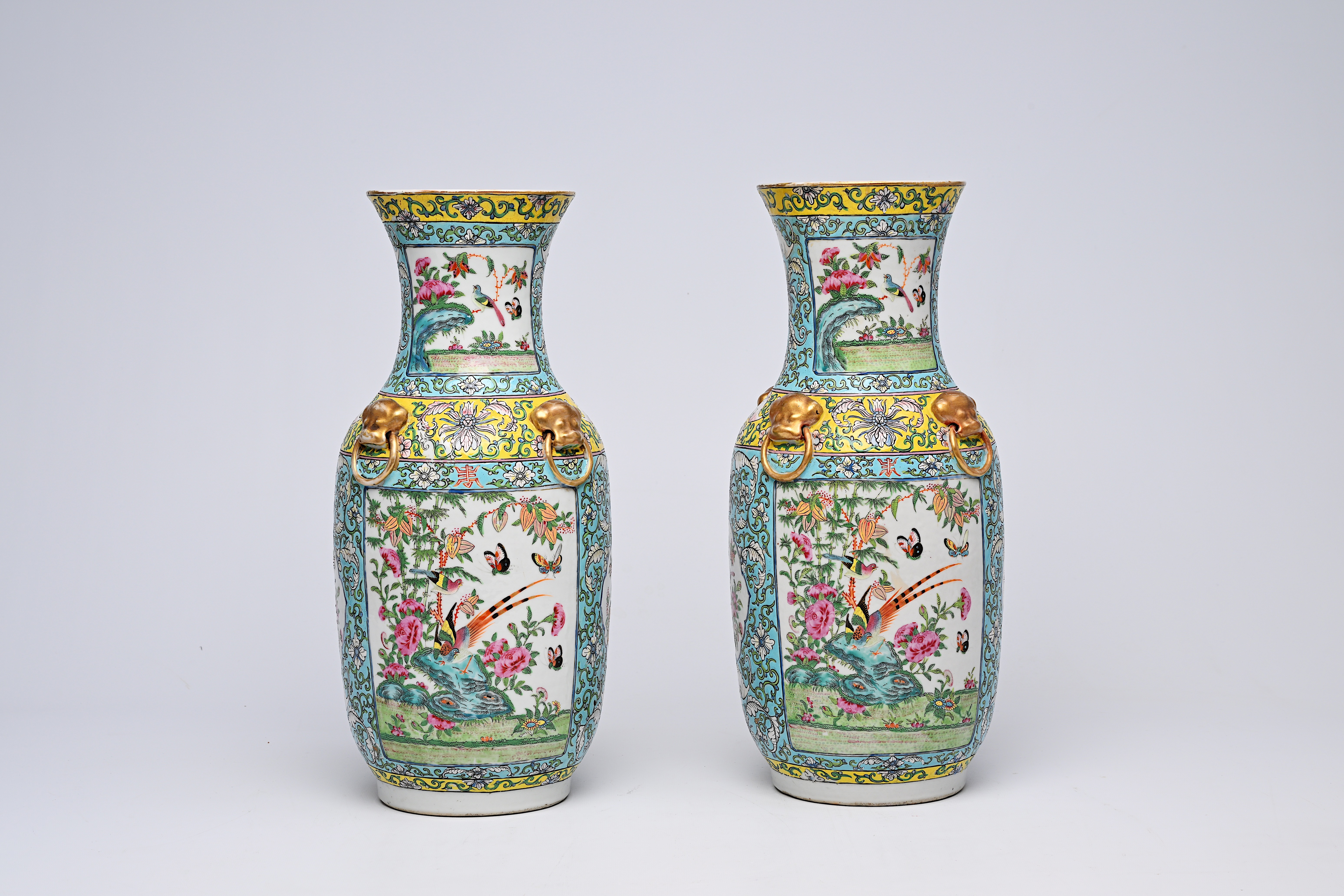 A pair of Chinese Canton famille rose turquoise ground vases with birds and butterflies among blosso - Image 3 of 13