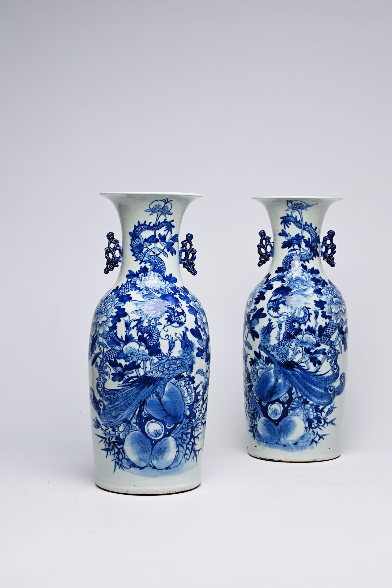 A pair of Chinese blue and white celadon ground vases with a dragon and a phoenix among blossoming b - Image 24 of 28