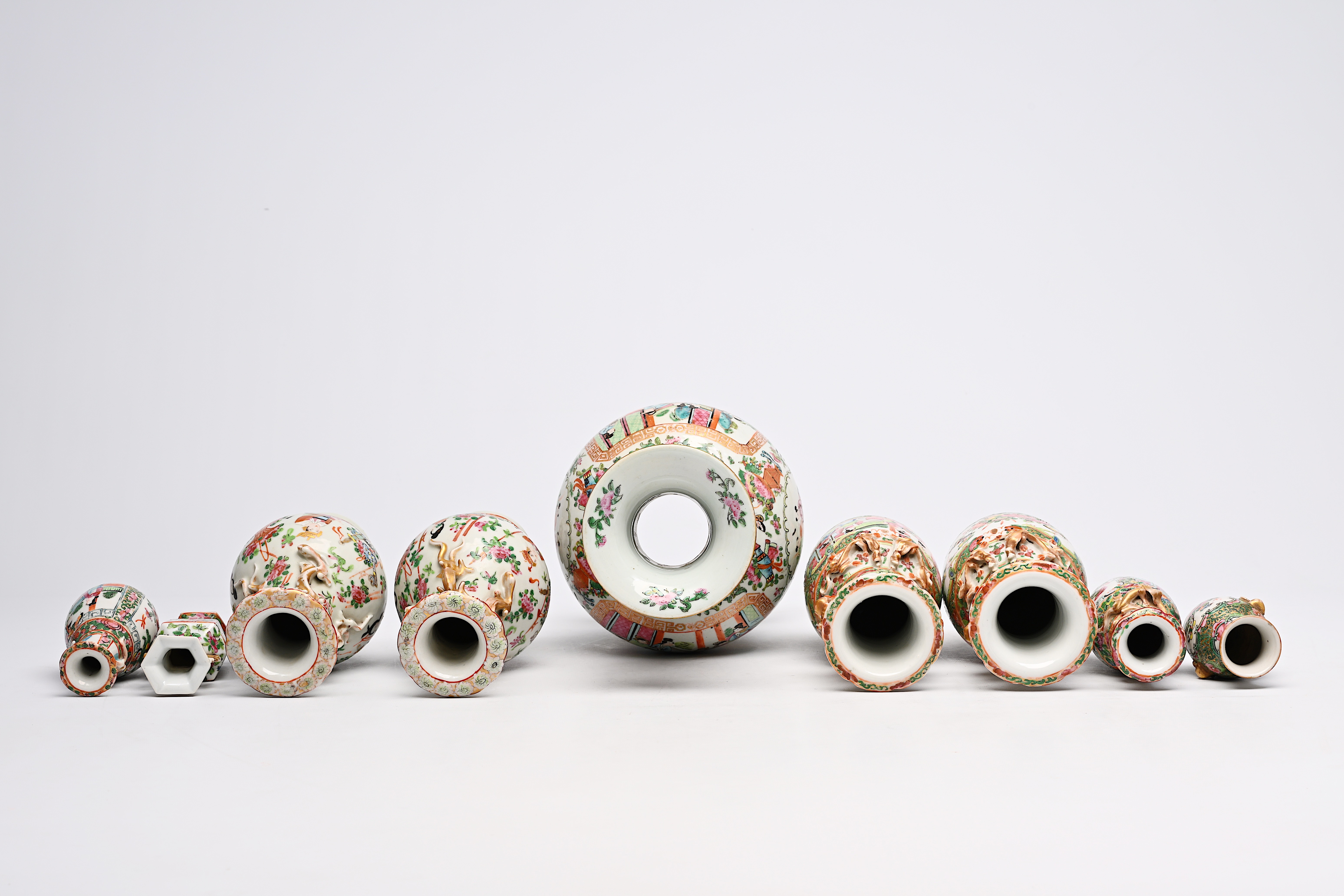 A varied collection of nine Chinese Canton famille rose vases, including two pairs, 19th C. - Image 7 of 8
