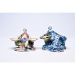 Two Dutch Delft blue and white and polychrome salts in the form of a man and a woman, 18th/19th C.