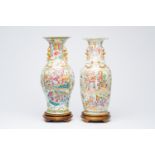 Two Chinese Canton famille rose vases with palace scenes and floral design, 19th C.