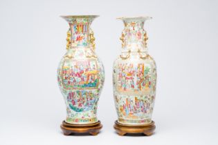 Two Chinese Canton famille rose vases with palace scenes and floral design, 19th C.