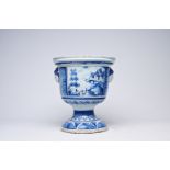 A French blue and white vase on stand with oriental landscapes and mascarons, Nevers, 18th C.