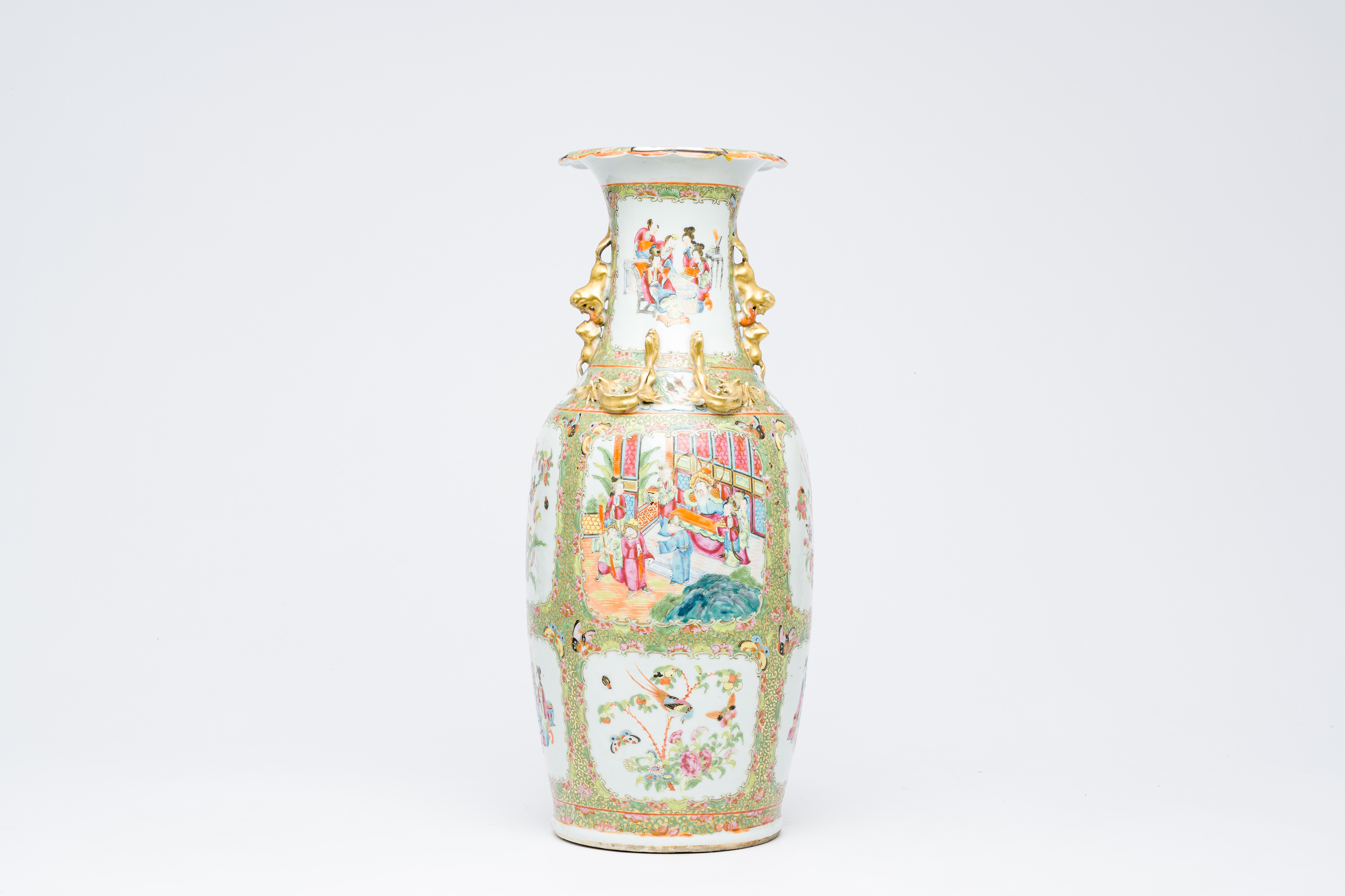 A Chinese Canton famille rose vase with palace scenes and birds and butterflies among blossoming bra