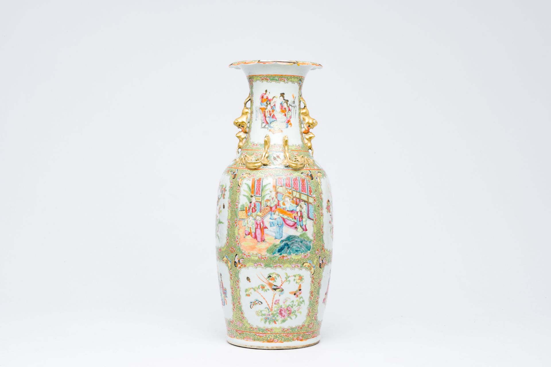 A Chinese Canton famille rose vase with palace scenes and birds and butterflies among blossoming bra